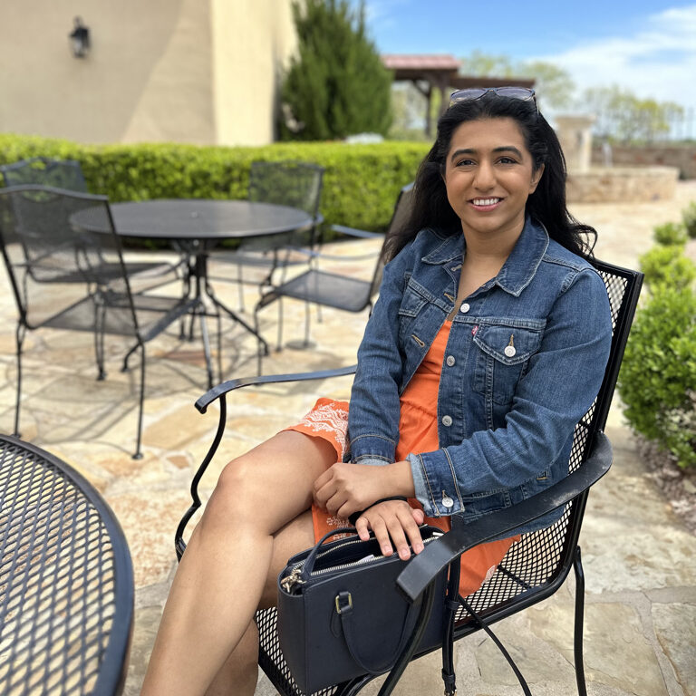 Jean jacket, orange dress at Grape Creek Vine yards